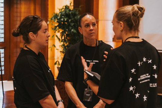 Three studio managers in conversation between sessions