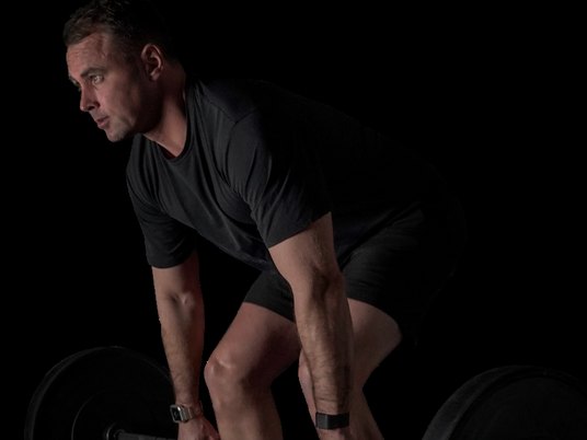 A member setting up a heavy deadlift